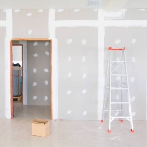 Plaster Repairs Romeos4 stair and gypsum board wall interior decoration of home at construction site with copy space add text